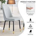 Table And Chair Set.The Table Has A Glass Top With Imitation Marble Pattern Stickers And Stainless Steel Golden Legs. Paried With Chairs With Pu Artificial Leather Backrest Cushions And Black Legs. Black Gold Seats 6 Glass Metal