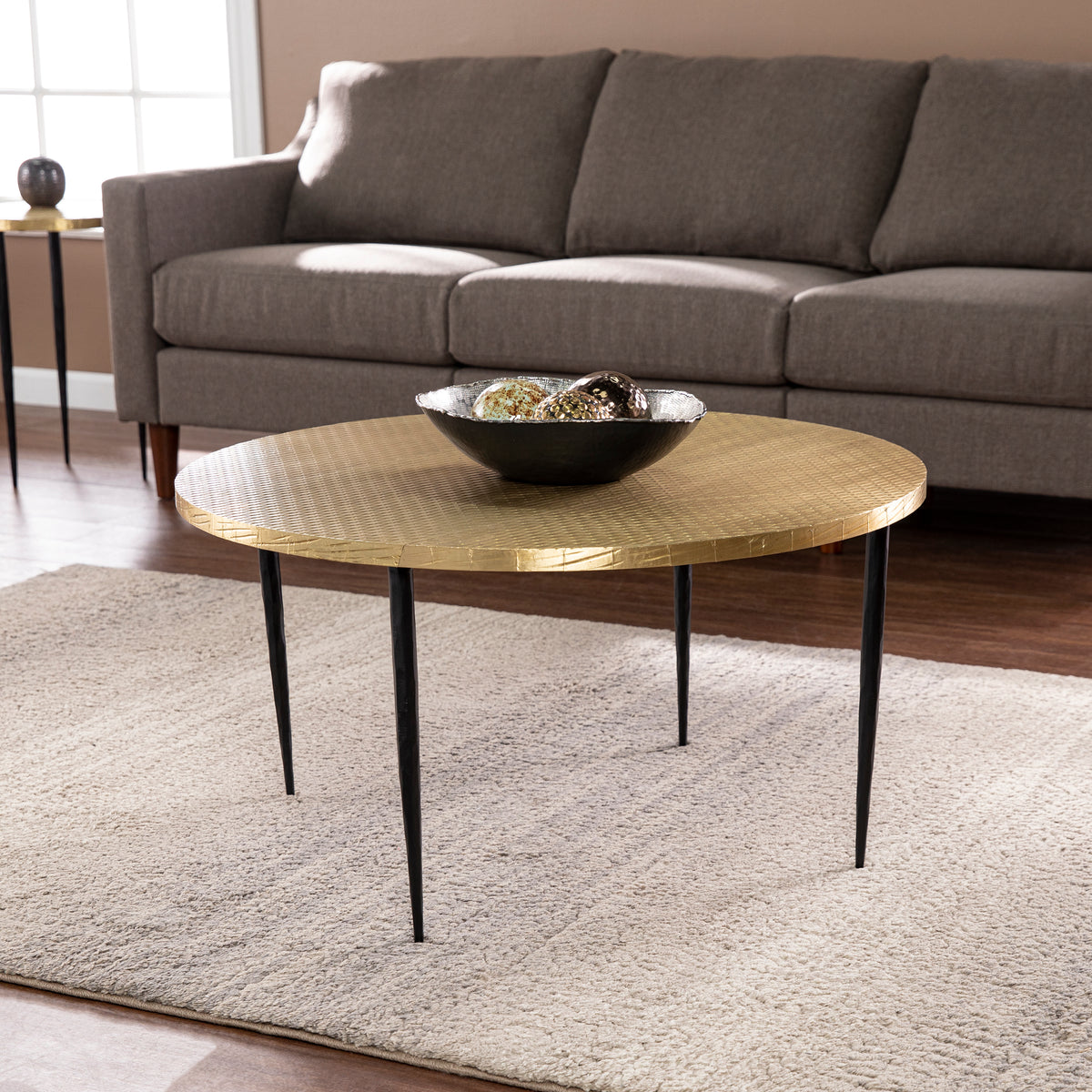 Judmont Round Cocktail Table W Embossed Top Black Iron